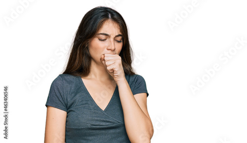 Young beautiful teen girl wearing casual crop top t shirt feeling unwell and coughing as symptom for cold or bronchitis. health care concept.