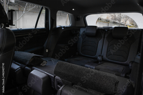 Folding seats and a cargo space inside suv car. Modern car interior. Huge, clean and empty car trunk. © Roman