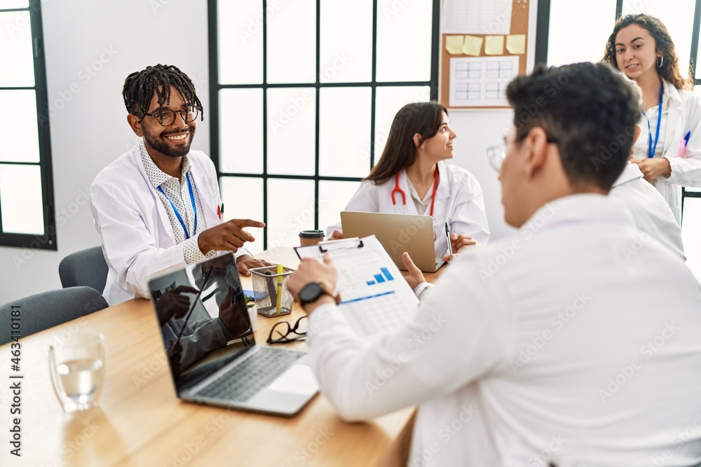 Group of young doctor people discussing in a medical meeting at the clinic office. Group of young doctor people discussing in a medical meeting at the clinic office.