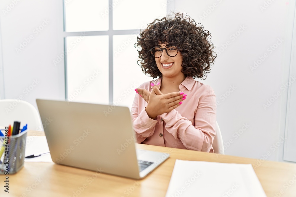 Young middle east woman having video call communicating with deaf language at office Young middle east woman having video call communicating with deaf language at office