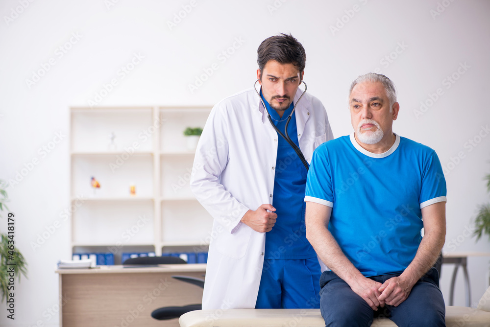 Old male patient visiting young male doctor Old male patient visiting young male doctor