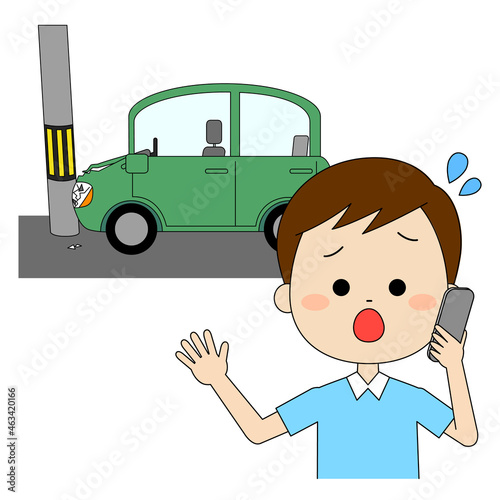 事故車と電話連絡している男性