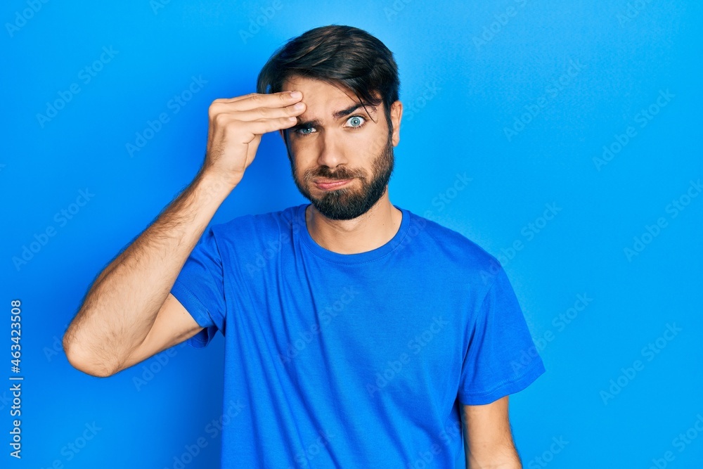 Young hispanic man wearing casual clothes worried and stressed about a problem with hand on forehead, nervous and anxious for crisis Young hispanic man wearing casual clothes worried and stressed about a problem with hand on forehead, nervous and anxious for crisis