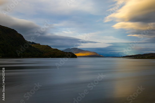 The rocky beach at Elgol on the Isle of Skye in Scotland. minimalist Scottish landscape of a misty morning on a calm, Loch Fada lake on the Isle of Skye, Scotland photo