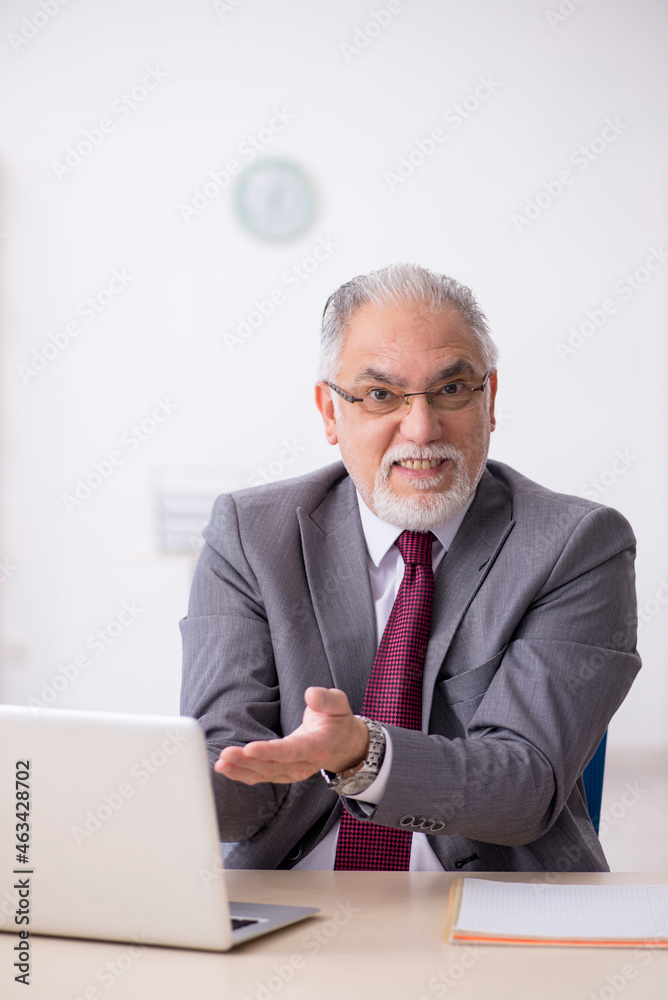 Old male employee and too much work in the office Old male employee and too much work in the office