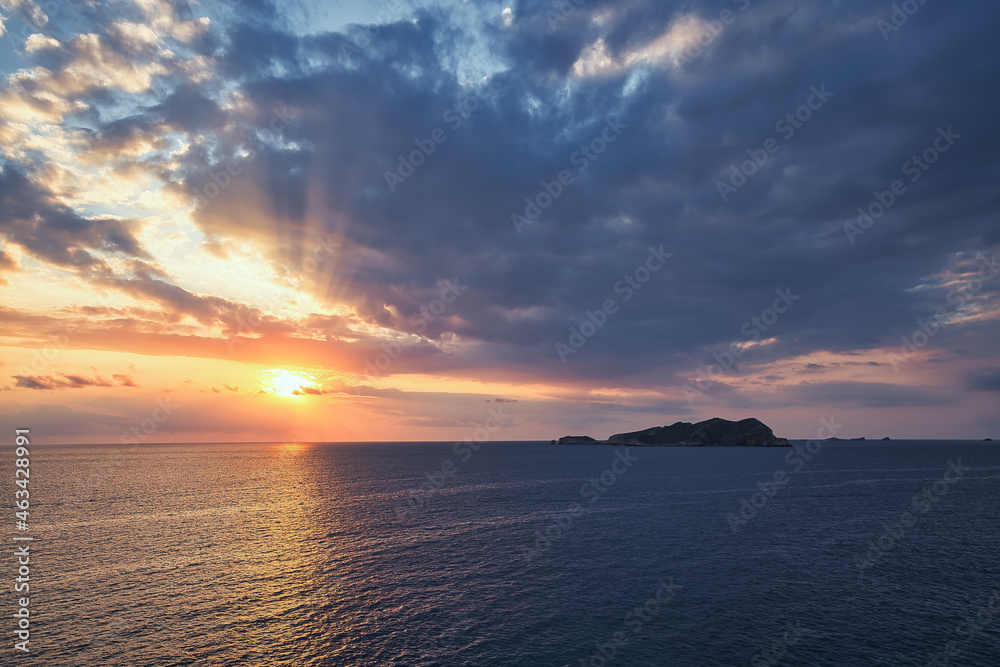 Beautiful sunset with a dramatic sky and clouds over the sea