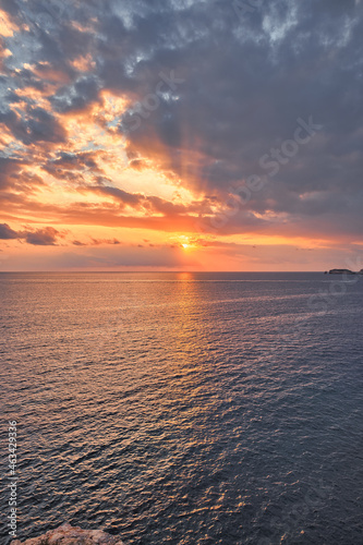 Beautiful sunset with a dramatic sky and clouds over the sea