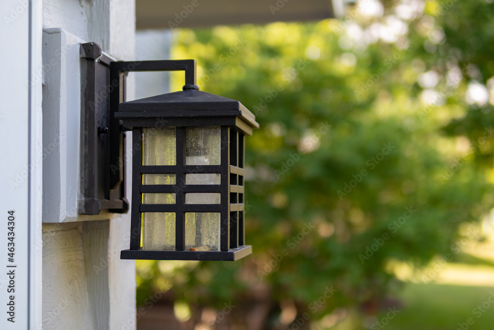 Outdoor Light on the Side of a Midwestern Home in a Summer Garden