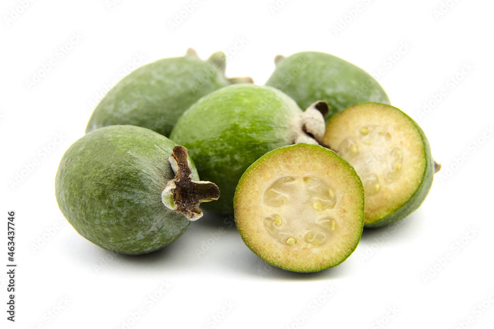 Feijoa fruit or whole and half pineapple guava isolated on white Feijoa fruit or whole and half pineapple guava isolated on white