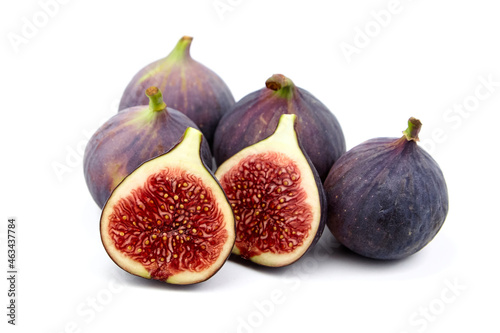 Fig fruit with ripe red halves isolated on white