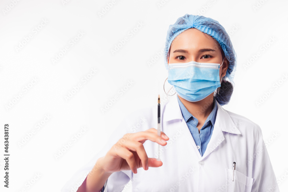 Happy smiling Asian Doctor hold syringe dose patient vaccine injection treatment Beauty doc wear surgical face mask Surgical cap and Doctor uniform stand over white background Copy space Health care Happy smiling Asian Doctor hold syringe dose patient vaccine injection treatment Beauty doc wear surgical face mask Surgical cap and Doctor uniform stand over white background Copy space Health care