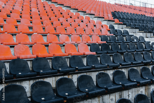 Empty stands and seats for fans and fans in the open-air stadium. Lack of fans during the pandemic.