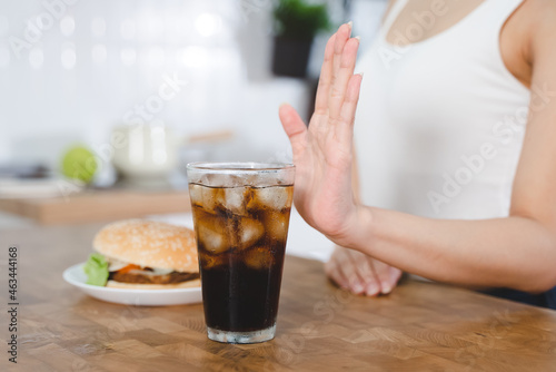 women avoid to eat soft drink and junk food.