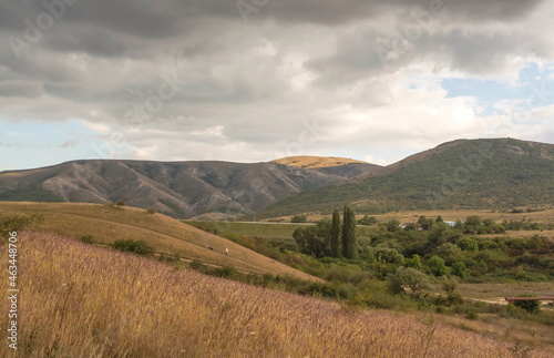 Mountain landscape under cloudy sky