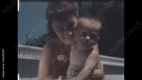 Baby Boy Mother 1952 - A young mother nurtures her baby boy with love in the early 1950s 