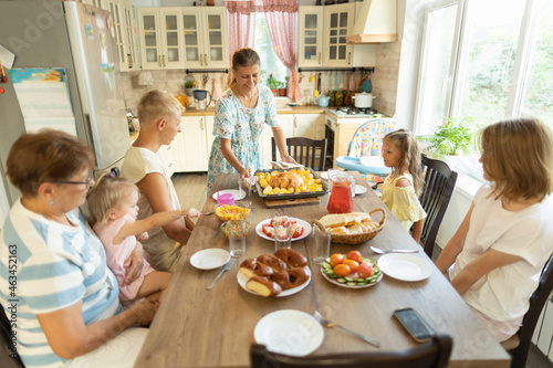 big family at the dinner table .