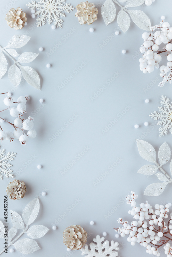 Christmas and New Year holidays frame. Christmas ornaments on light pastel background. Flat lay, copy space. Christmas and New Year holidays frame. Christmas ornaments on light pastel background. Flat lay, copy space.