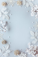 Christmas and New Year holidays frame. Christmas ornaments on light pastel background. Flat lay, copy space.