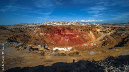 Troulloi copper mine in Larnaca area, Cyprus. Abandoned open pit and red cap (gossan) rich with iron oxides and quartz photo