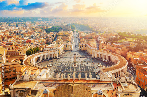 Famous Saint Peter's Square in Vatican and aerial view of the Rome city during sunny day sunset © Nikolay N. Antonov