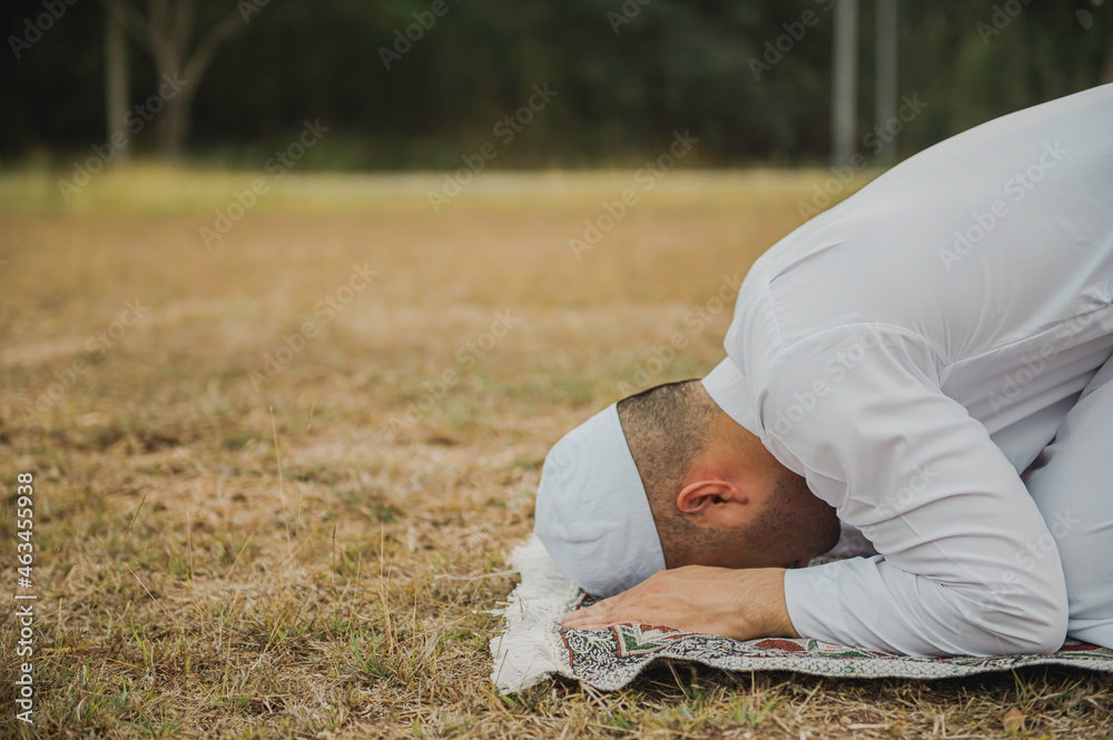 Asian white islam man prayer,Young Muslim praying,Ramadan festival concept Asian white islam man prayer,Young Muslim praying,Ramadan festival concept