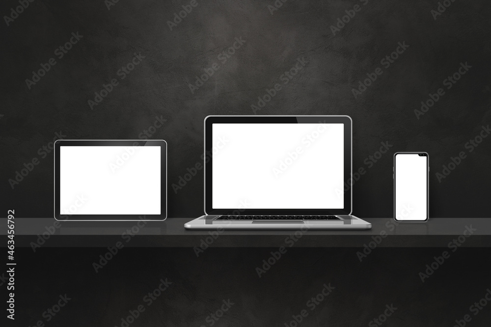 Laptop, mobile phone and digital tablet pc on black wall shelf. Horizontal background Laptop, mobile phone and digital tablet pc on black wall shelf. Horizontal background