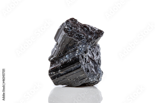 macro mineral stone sherle, schorl, black tourmaline on white background photo