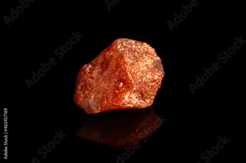 Macro mineral stone Nepheline sunny stone black background photo