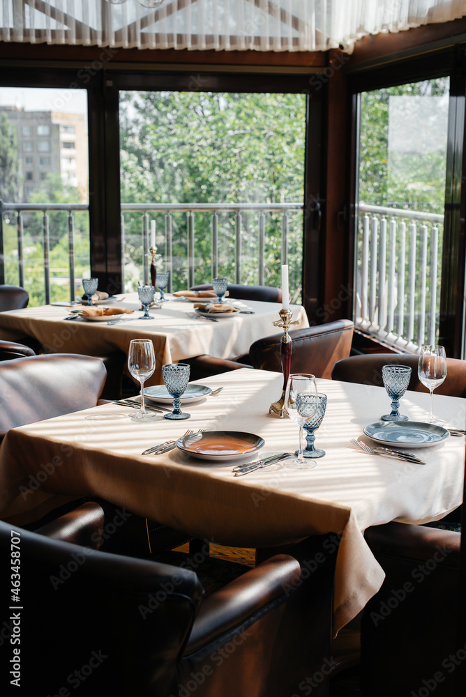 A beautifully laid table with exquisite dishes in a modern restaurant.