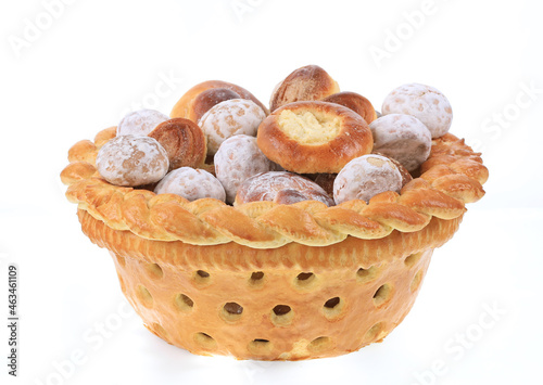 bread basket with sweet buns isolated on white background