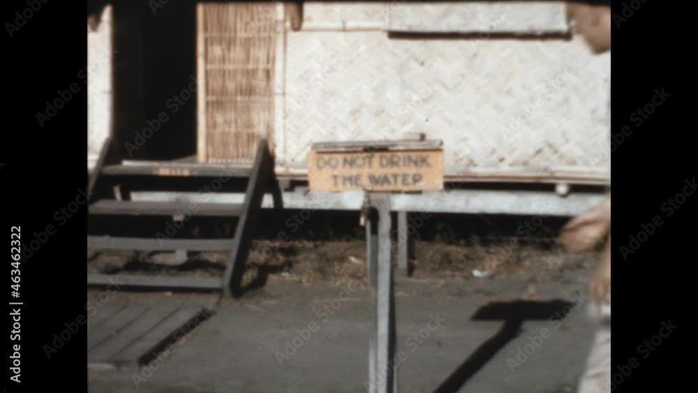 Do Not Drink The Water 1946 - A man drinks from a spigot marked Do Not Drink The Water 1946 - A man drinks from a spigot marked