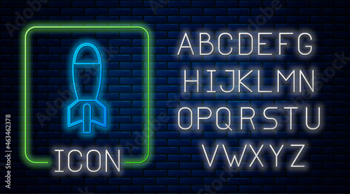 Glowing neon Rocket launcher with missile icon isolated on brick wall background. Neon light alphabet. Vector