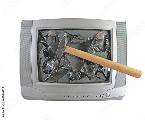 Smashed old kinescope television. hammer smashes old TV. Broken monitor photo