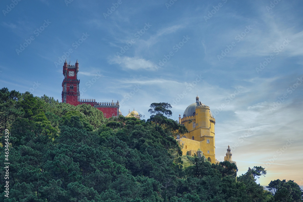 View of the Palacio da Pena in Sintra (Portugal) among trees at sunset