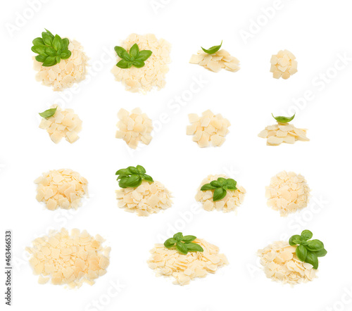Pile of parmesan cheese flakes and crumbs isolated photo