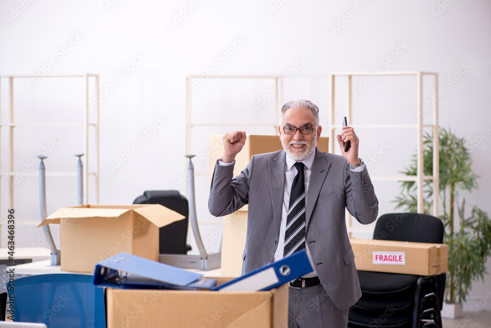 Old male employee in relocation concept Old male employee in relocation concept