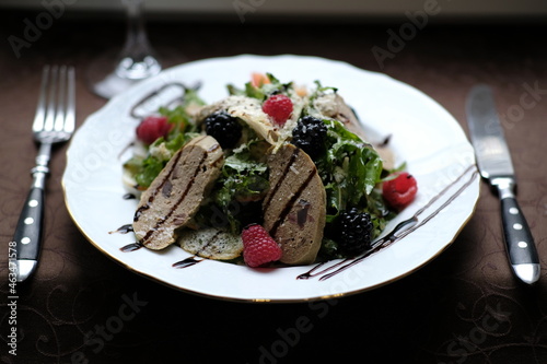 salad of herbs, berries and meat pate