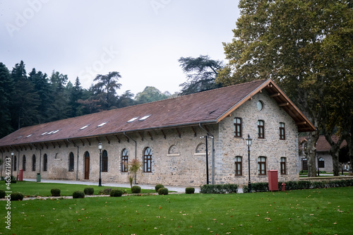 Beykoz, Istanbul, Turkey - October 2021: Beykoz Glass and Crystal Museum. Stone museum building and colorful trees in autumn. Beautiful building in the forest. Selective focus.