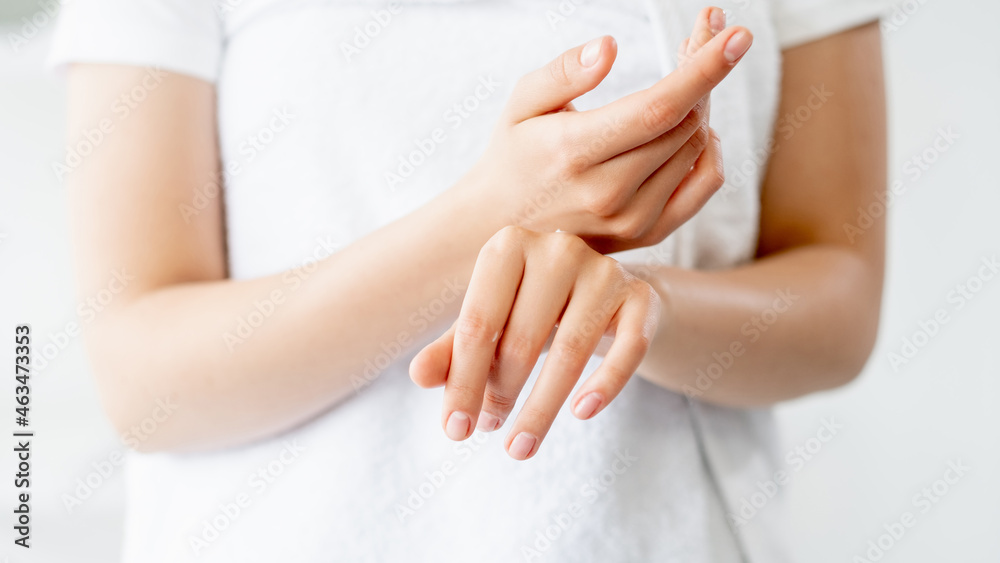 Hand care. Skin moisturizing. Beauty wellness. Closeup of woman palms rubbing cosmetic organic revitalizing cream at white background. Hand care. Skin moisturizing. Beauty wellness. Closeup of woman palms rubbing cosmetic organic revitalizing cream at white background.