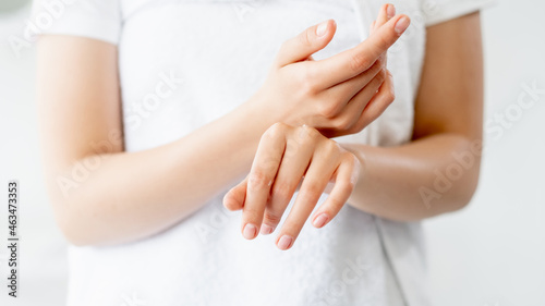 Hand care. Skin moisturizing. Beauty wellness. Closeup of woman palms rubbing cosmetic organic revitalizing cream at white background.