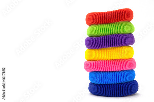 Column of multicolored scrunchies, elastic hair ties, cotton hair ponytail holders, seamless hair bands