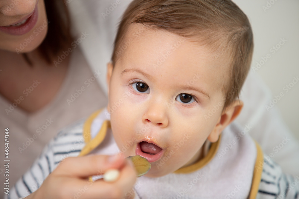 happy infant baby boy spoon eats itself happy infant baby boy spoon eats itself