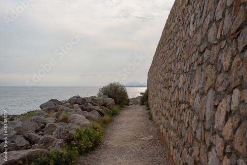 Cap d'Antibes hiking trail. Stone path at the seaside. 