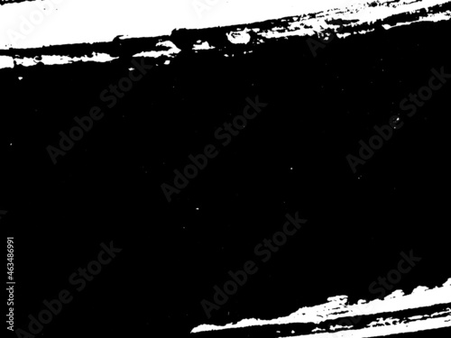 Grunge is black and white. Texture of black strokes on a white background. Abstract chaotic movements with a dry brush. Monochrome pattern of worn surface