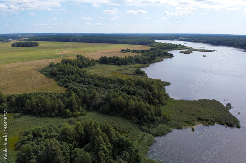 Aerial view of summer landscape with forest river and fields
