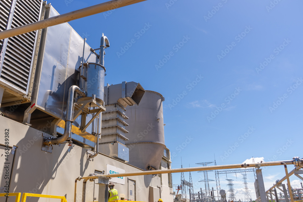 Construction of the firts natural gas energy plant of central america, trucks, construction machinery, workers, turbines and storage tanks. Construction of the firts natural gas energy plant of central america, trucks, construction machinery, workers, turbines and storage tanks.