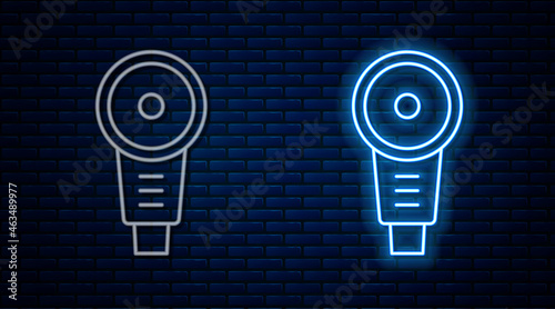 Glowing neon line Angle grinder icon isolated on brick wall background. Vector