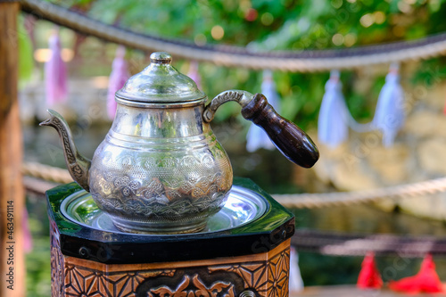 Close up traditional metal tea pot.