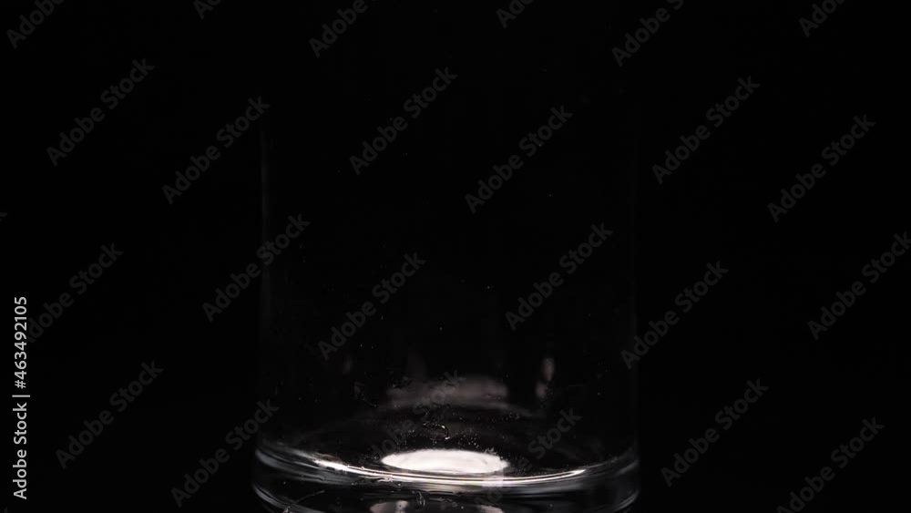 pouring ice cubes into glass slow motion pouring ice cubes into glass slow motion