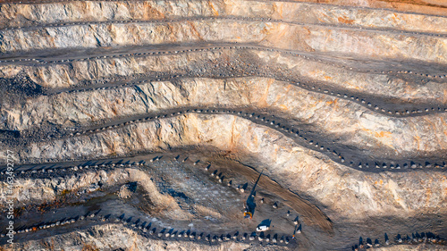 aerial view of the interior of a deep stone quarry, large rocks